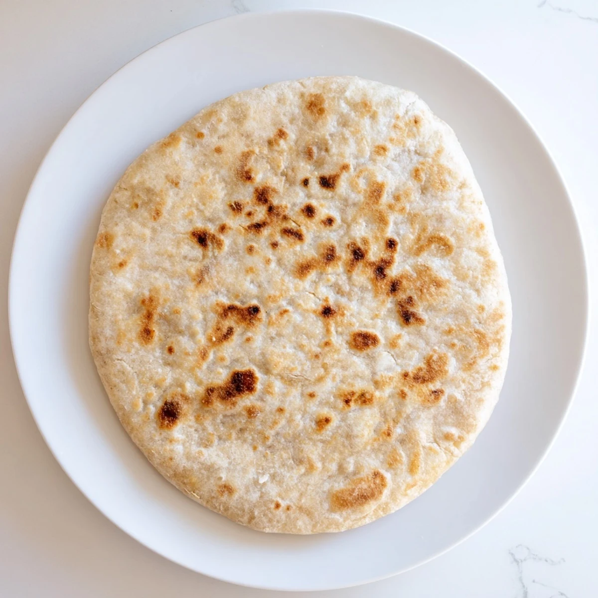 These warm, slightly puffed Three-Ingredient Easy Flatbreads are perfect for scooping up a hearty curry.