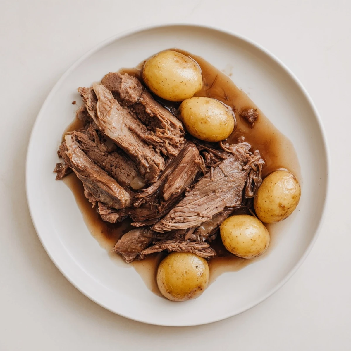 Delicious, juicy pot roast from the slow cooker, ready for slicing and enjoying with family.