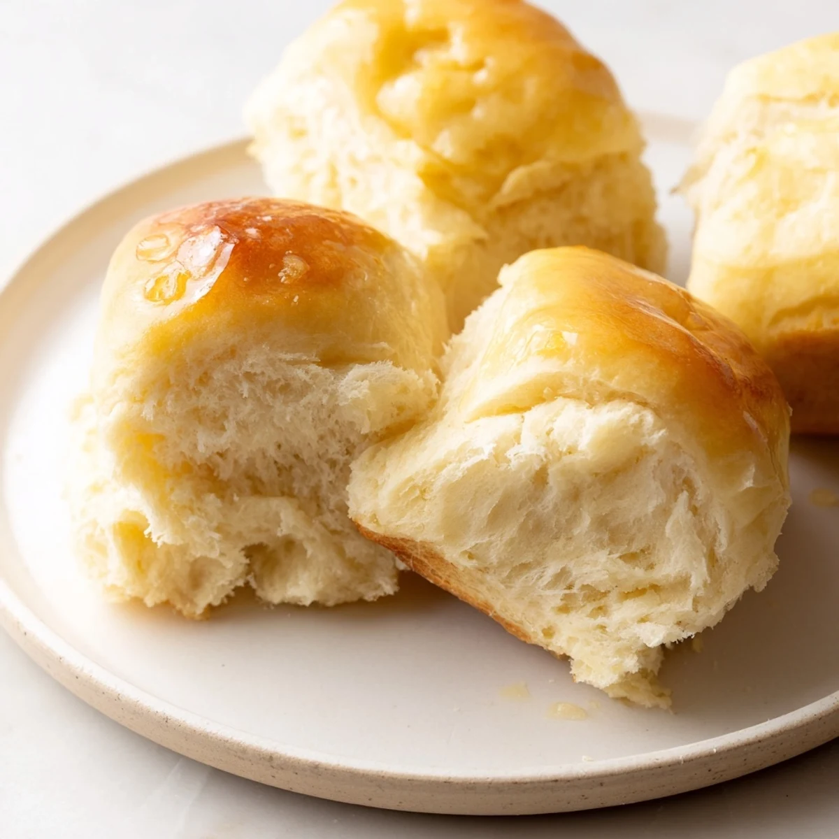 Golden, buttery Quick-Rise Dinner Rolls, perfectly baked and ready to serve warm with a pat of butter.