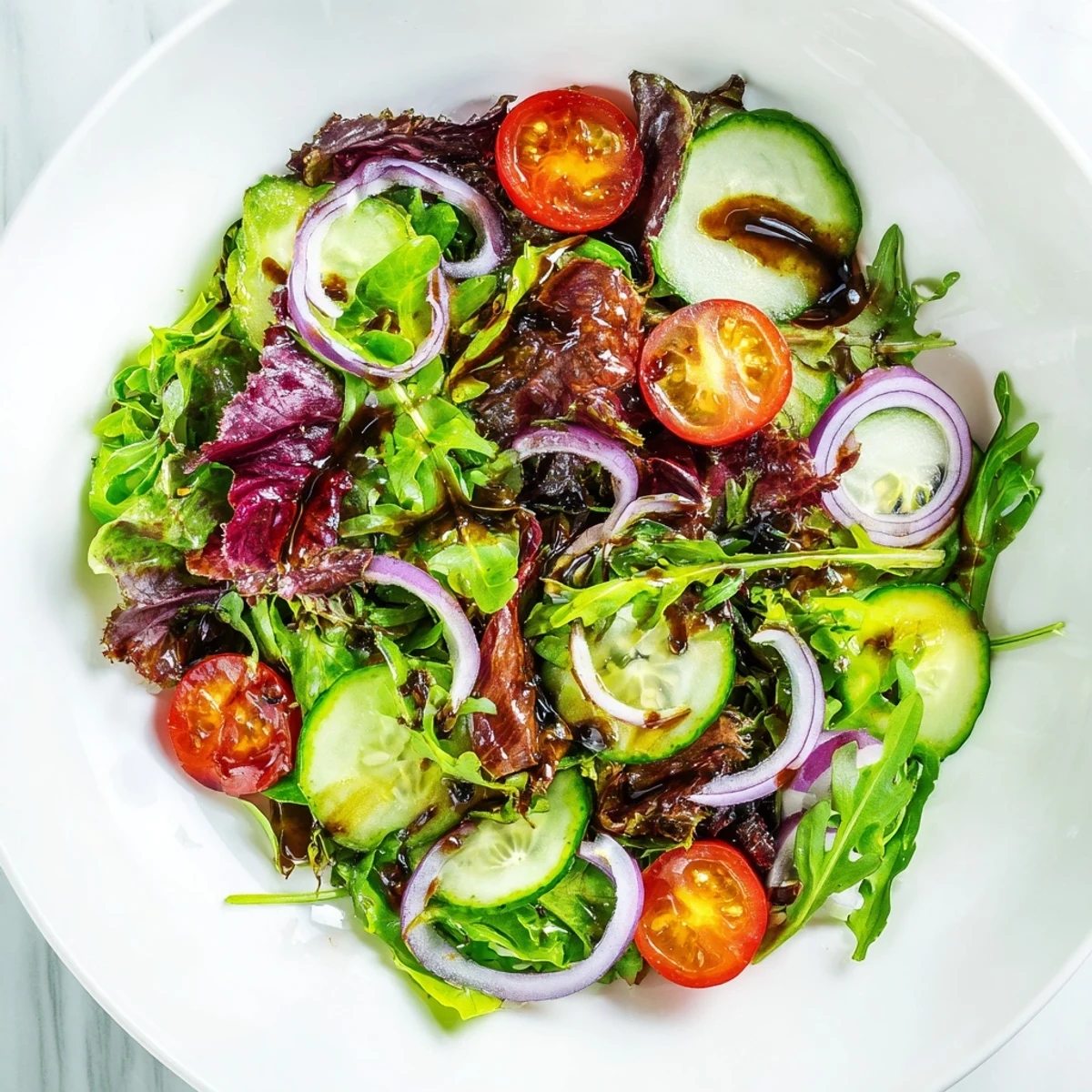 Fresh, bright quick Balsamic Vinegar Salad, tossed in a tangy balsamic vinaigrette, ready to serve.