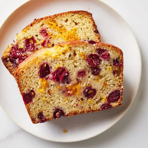 Warm, homemade Seasonal Cranberry and Orange Bread, with a tender crumb and inviting orange aroma.