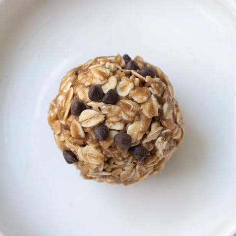 A close-up of perfectly formed No-Bake Peanut Butter Energy Balls ready to enjoy as a snack.