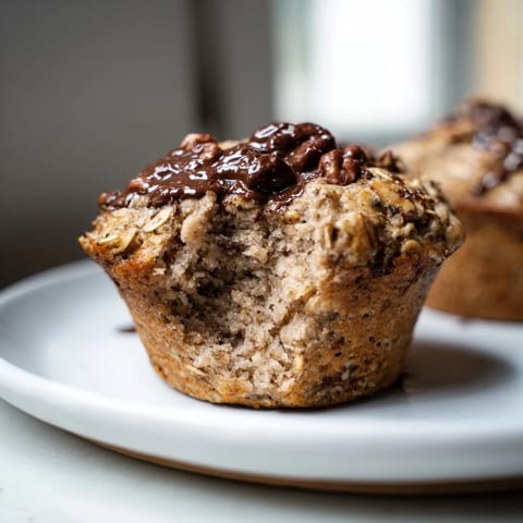 Warm, freshly baked freezer-friendly breakfast muffins showcasing moist texture and optional chocolate chips or nuts.