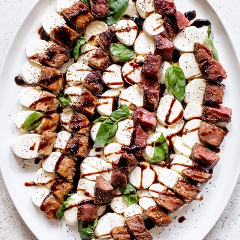 Close-up of The Safari Stripes: a party-ready, colorful appetizer with balsamic-glazed meat.
