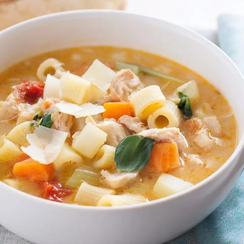 A close-up view of flavorful Marry Me Chicken Soup, showing tender chicken and creamy broth.