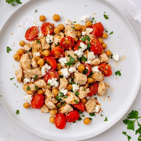 Perfect for a light dinner, this Mediterranean Chickpea Chicken Salad features briny olives and fresh parsley.