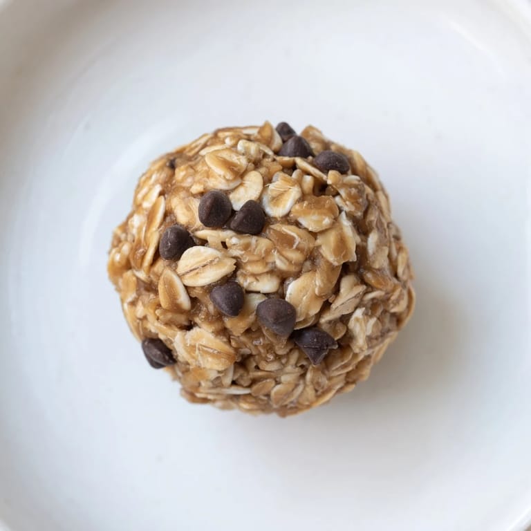 A close-up of perfectly formed No-Bake Peanut Butter Energy Balls ready to enjoy as a snack.