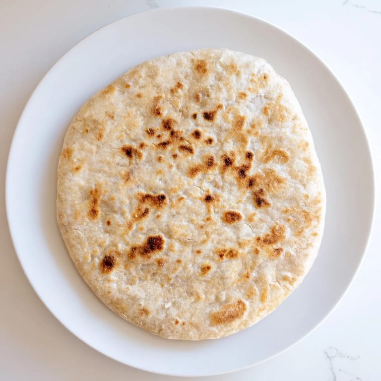 These warm, slightly puffed Three-Ingredient Easy Flatbreads are perfect for scooping up a hearty curry.