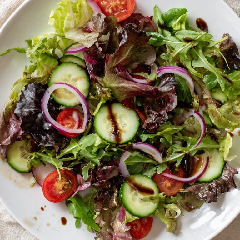 A colorful quick Balsamic Vinegar Salad featuring juicy tomatoes and crisp greens with a flavorful dressing.