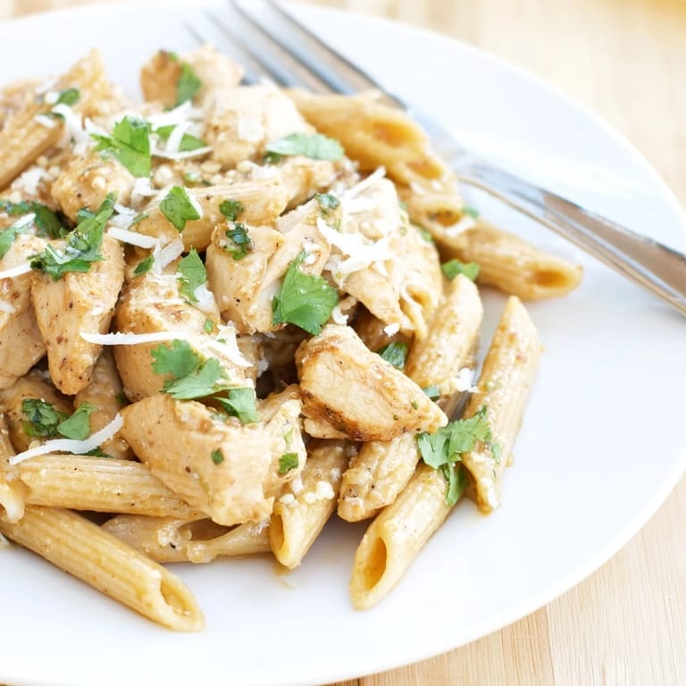 A hearty bowl of Honey Chipotle Chicken Pasta, featuring al dente penne and tender chicken in a sweet, smoky, and spicy sauce.