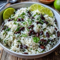 Vibrant coconut lime rice with beans, cilantro, and fresh lime zest.